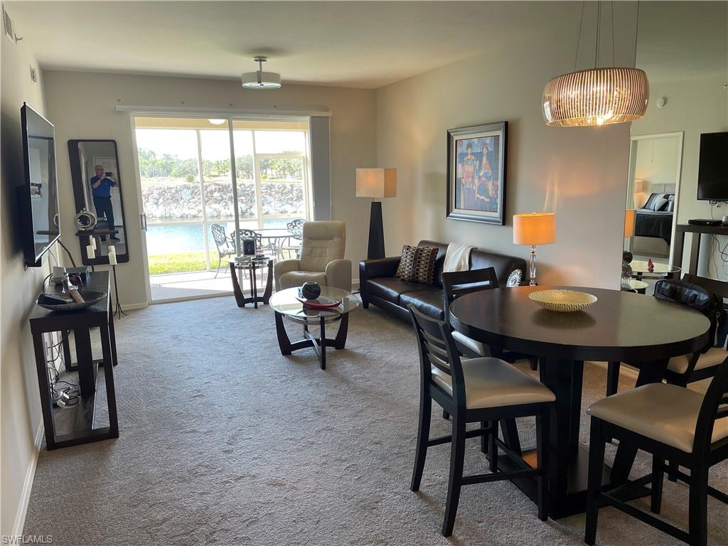 Undisclosed Address Naples, FL 34112 - Photo 6 of 28 a living room with furniture and a large window