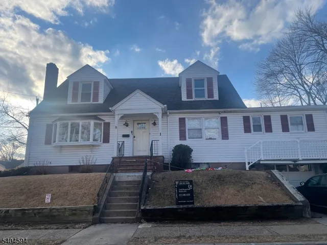 a front view of a house with garage