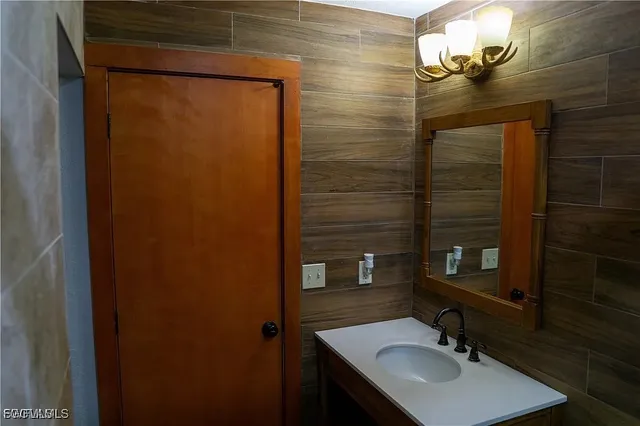 a bathroom with a sink and a mirror