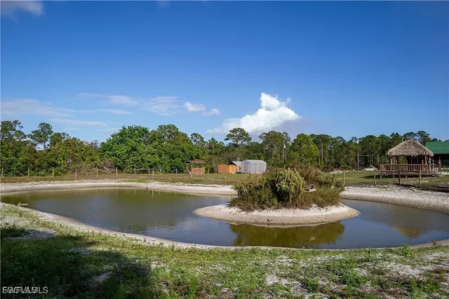 a view of a lake with a house in the background