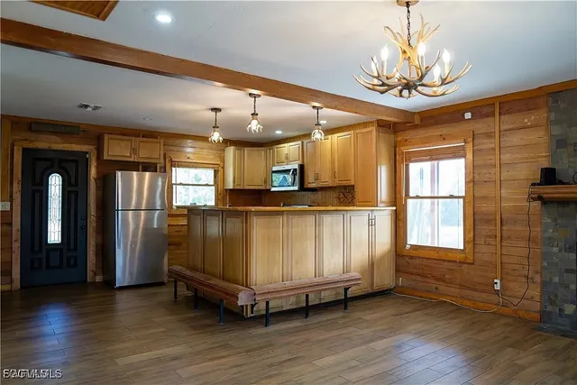 a view of a livingroom with furniture window and wooden floor