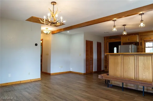 a view of a livingroom with furniture and chandelier