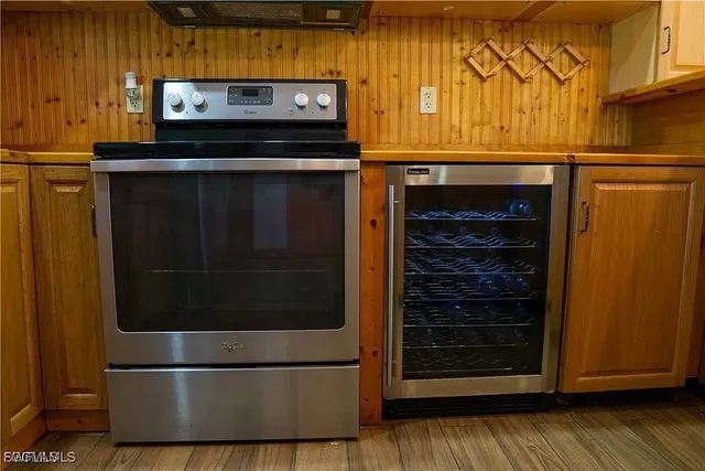 a stove top oven sitting inside of a kitchen