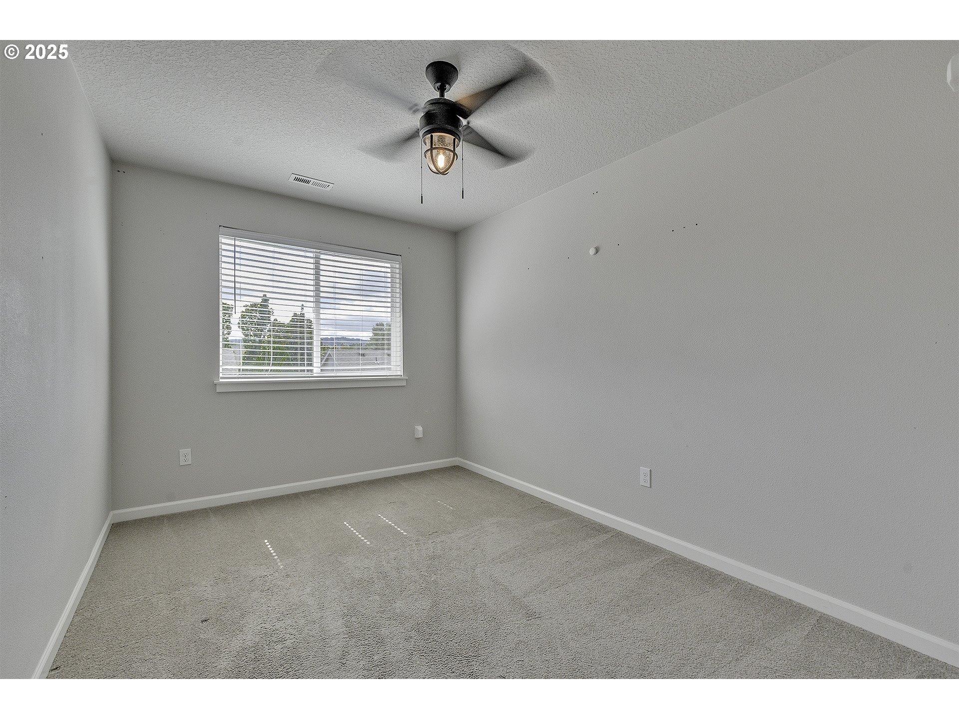 1015 South Nectarine Street Cornelius, OR 97113 - Photo 24 of 36 a view of an empty room with a window