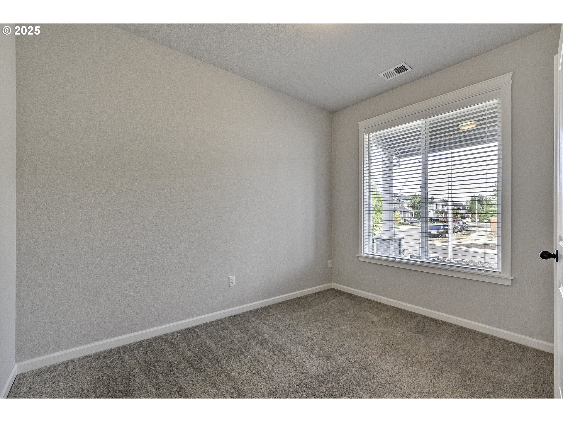 1015 South Nectarine Street Cornelius, OR 97113 - Photo 4 of 36 a view of an empty room with a window