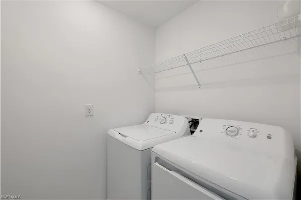 a utility room with dryer and washer