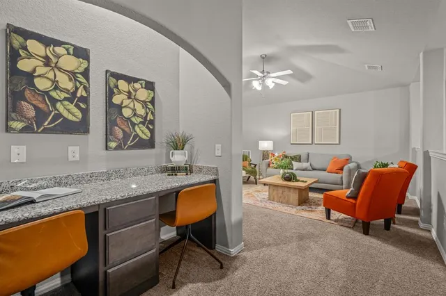 a living room with furniture and a window