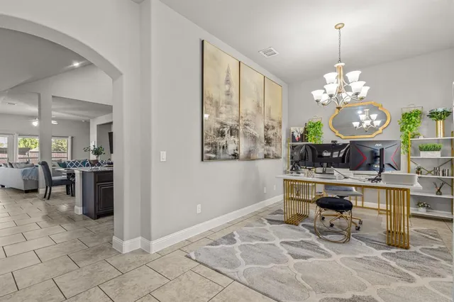 a very nice looking dining room with a large window