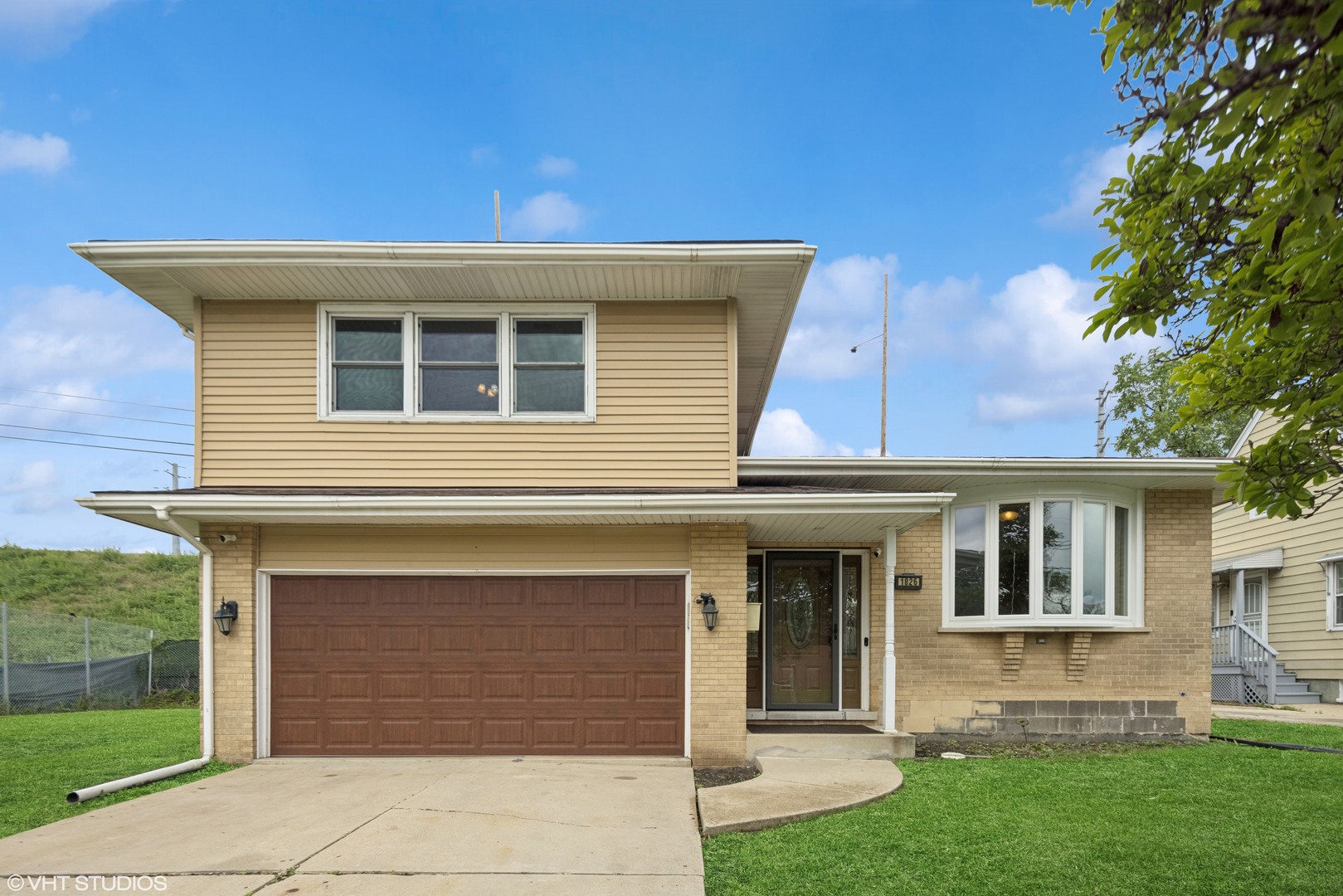 1826 Coolidge Avenue Berkeley, IL 60163 - Photo 1 of 15 front view of a house with a yard