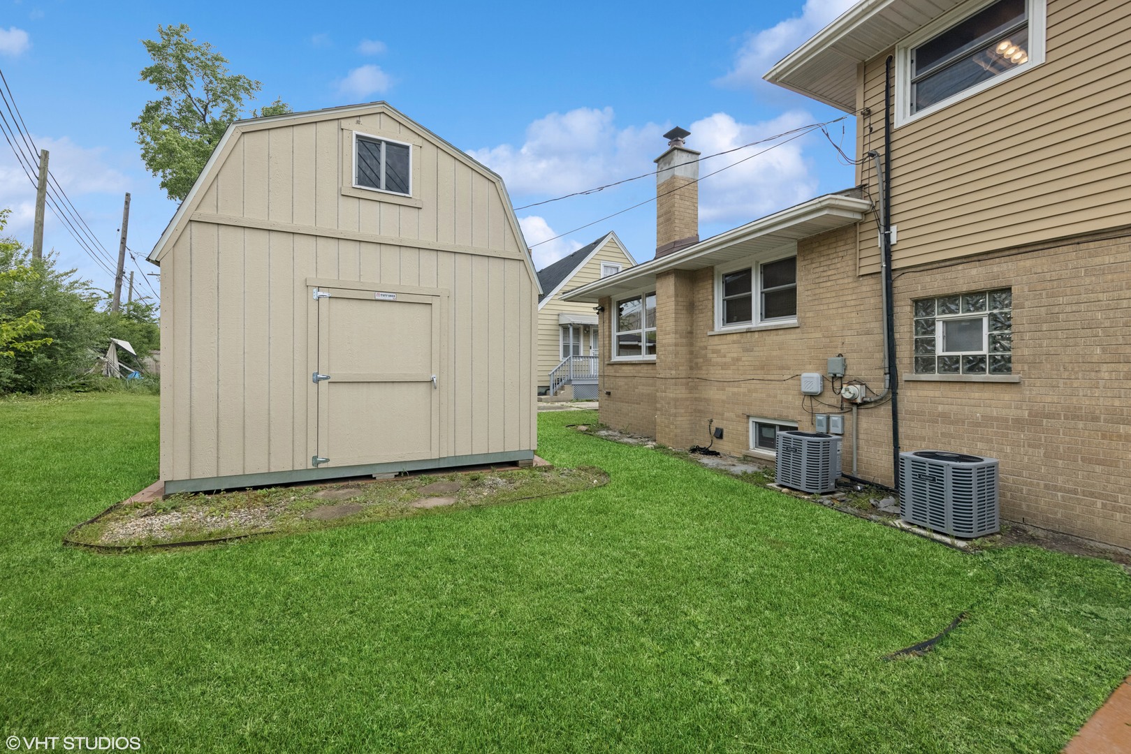 1826 Coolidge Avenue Berkeley, IL 60163 - Photo 13 of 15 a view of backyard with barbeque grill potted plants and a large tree