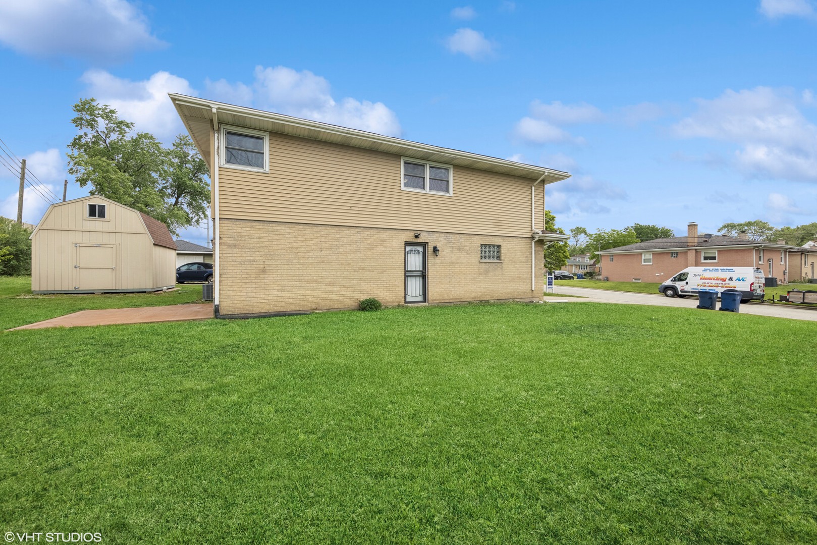 1826 Coolidge Avenue Berkeley, IL 60163 - Photo 14 of 15 a front view of a house with a garden and yard