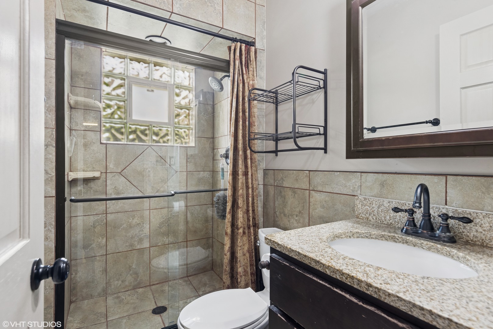 1826 Coolidge Avenue Berkeley, IL 60163 - Photo 10 of 15 a bathroom with a granite countertop sink a toilet and mirror