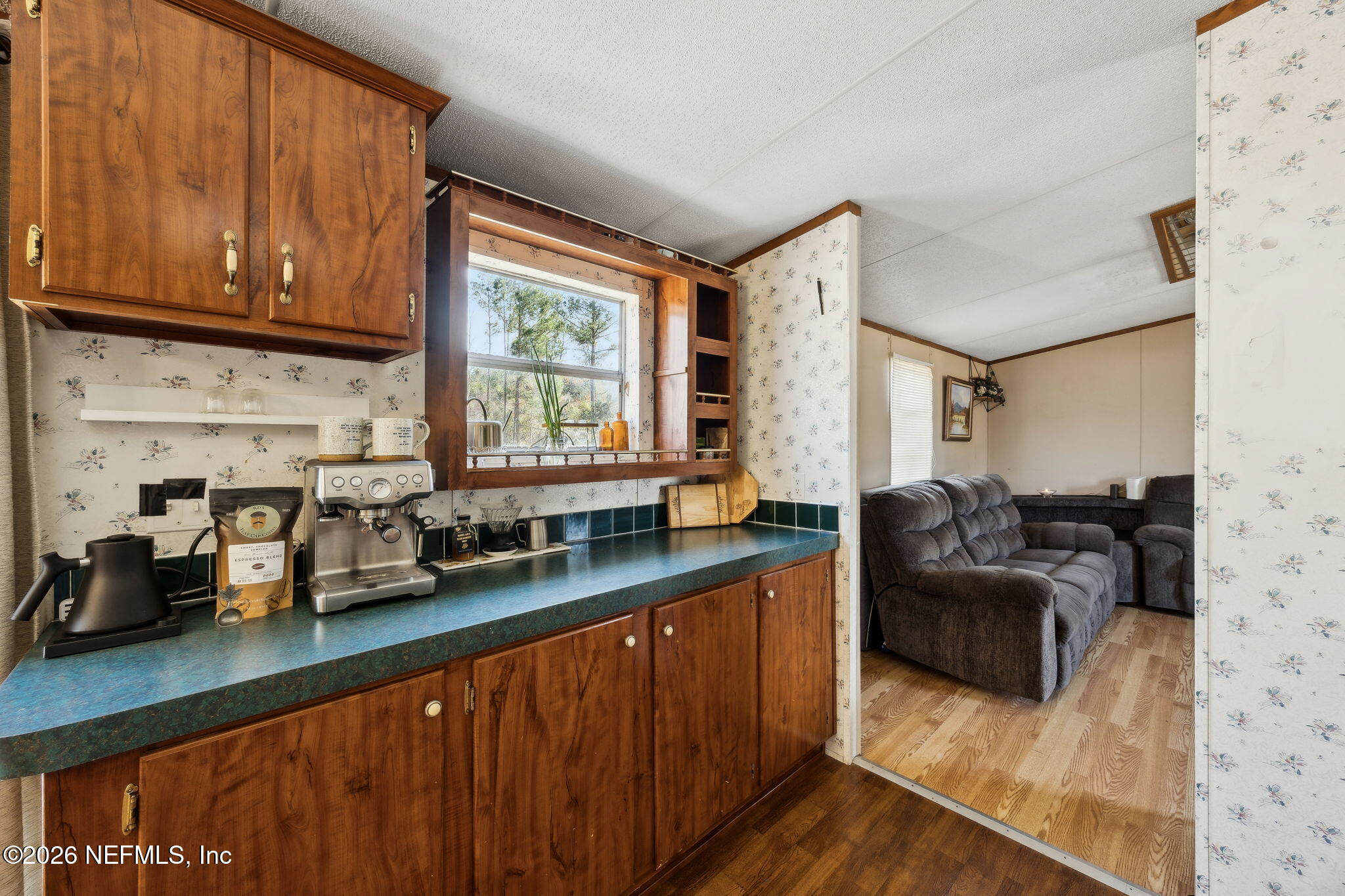 54002 Trooper Court Callahan, FL 32011 - Photo 13 of 56 a kitchen with granite countertop lots of counter top space