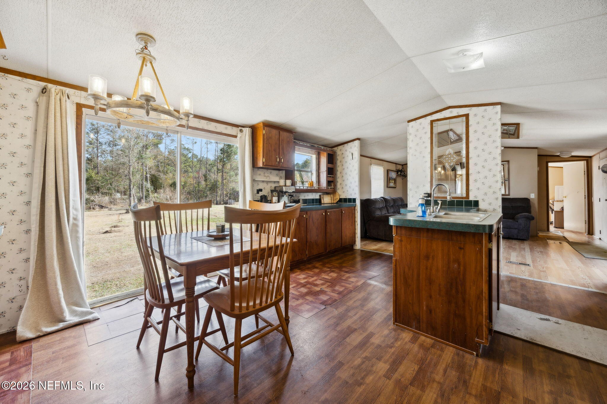 54002 Trooper Court Callahan, FL 32011 - Photo 18 of 56 a view of a dining room with furniture window and wooden floor