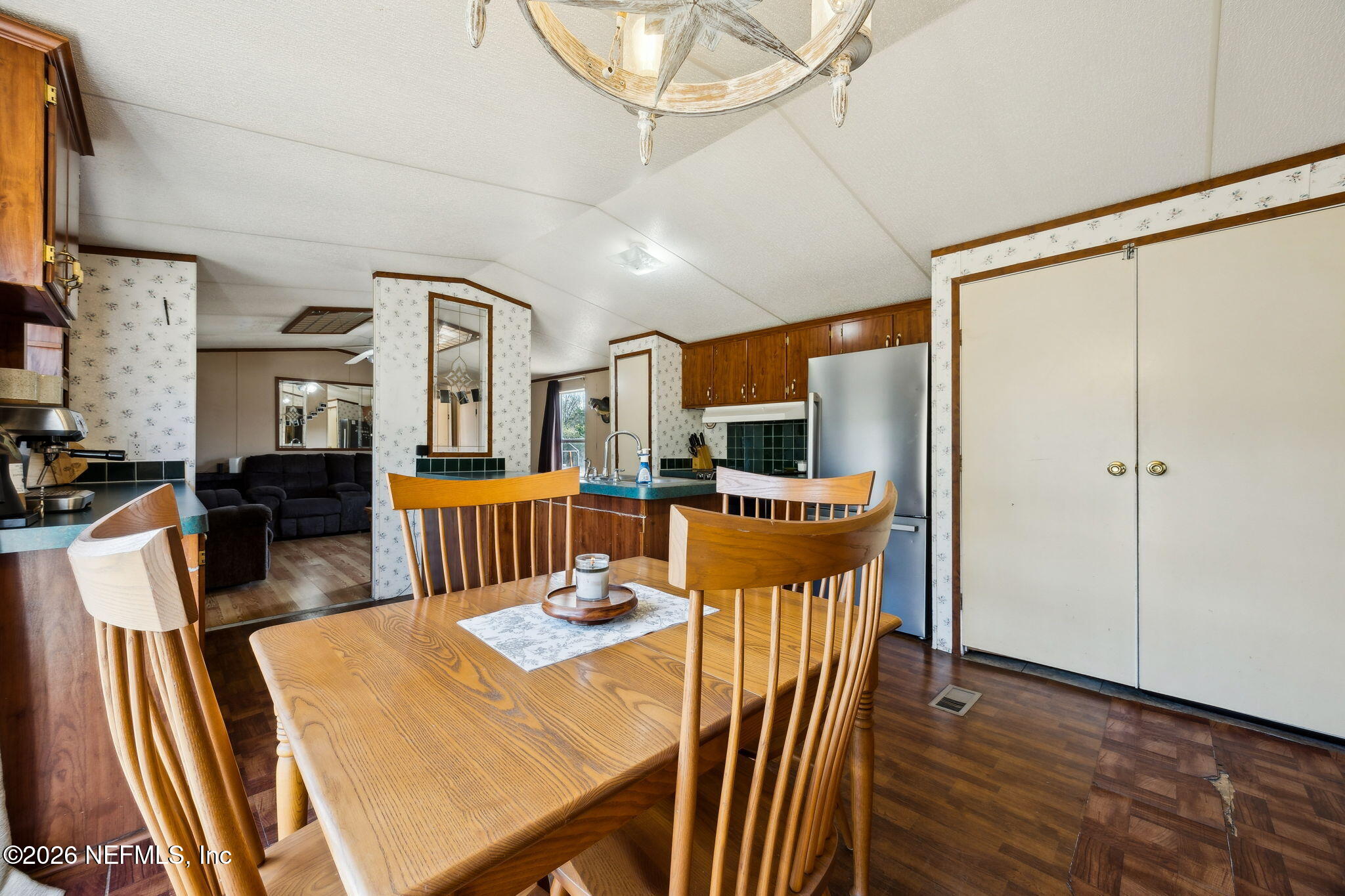 54002 Trooper Court Callahan, FL 32011 - Photo 19 of 56 a dining room with furniture a window and wooden floor