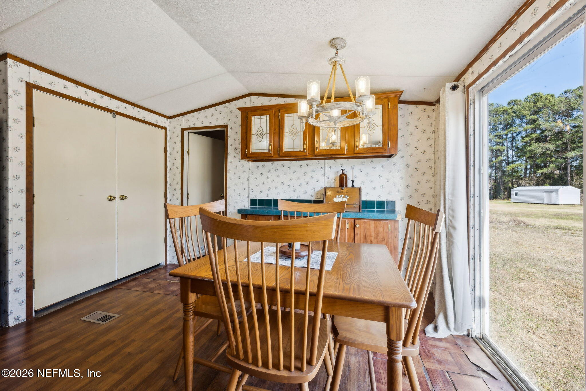 54002 Trooper Court Callahan, FL 32011 - Photo 20 of 56 a view of a dining room with furniture window and wooden floor