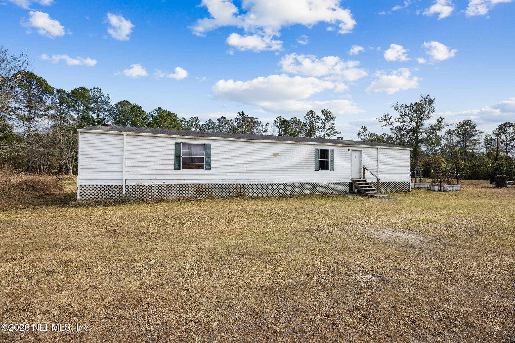 54002 Trooper Court Callahan, FL 32011 - Photo 2 of 56 a view of a house with a backyard