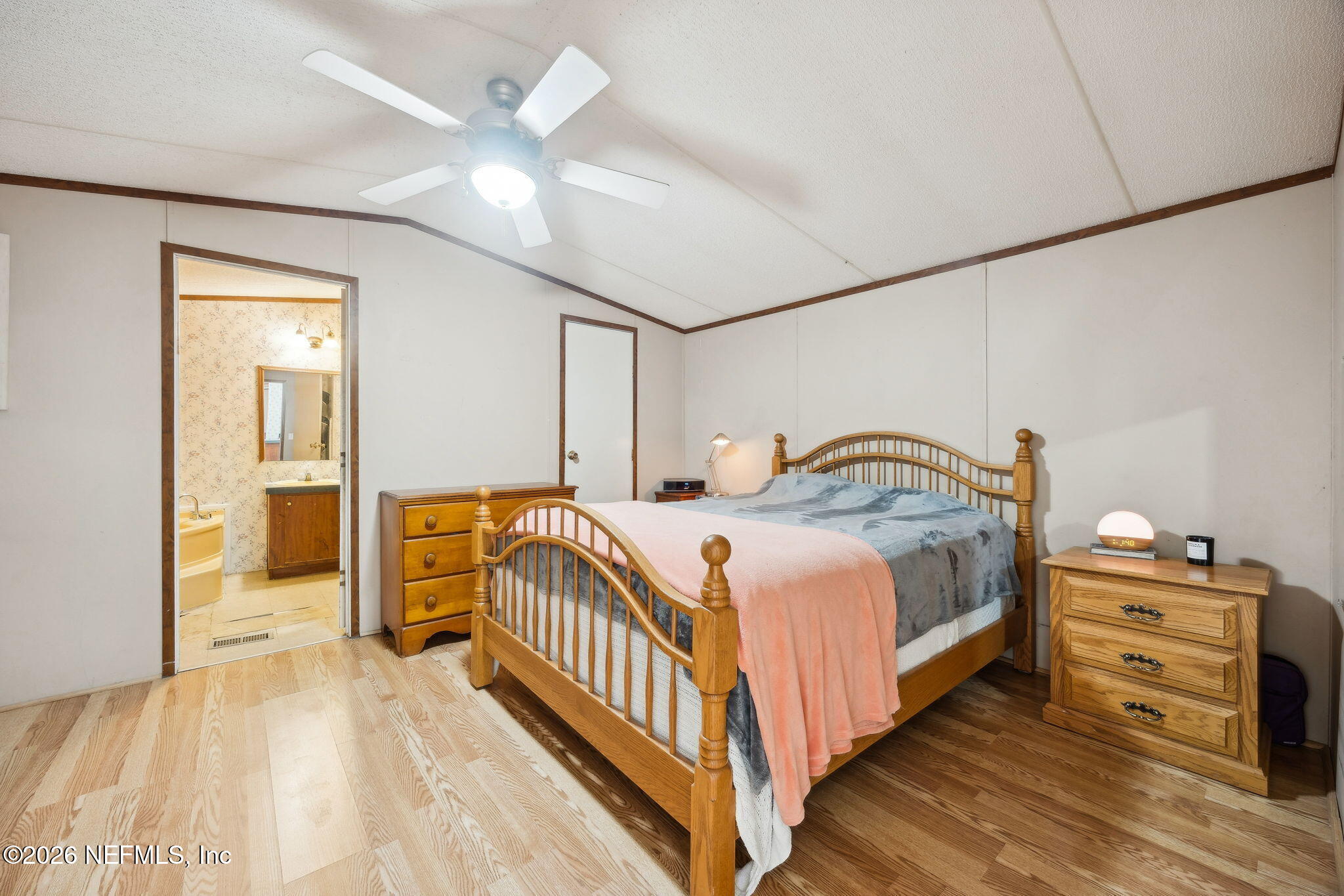 54002 Trooper Court Callahan, FL 32011 - Photo 21 of 56 a bedroom with a bed and a view of dresser