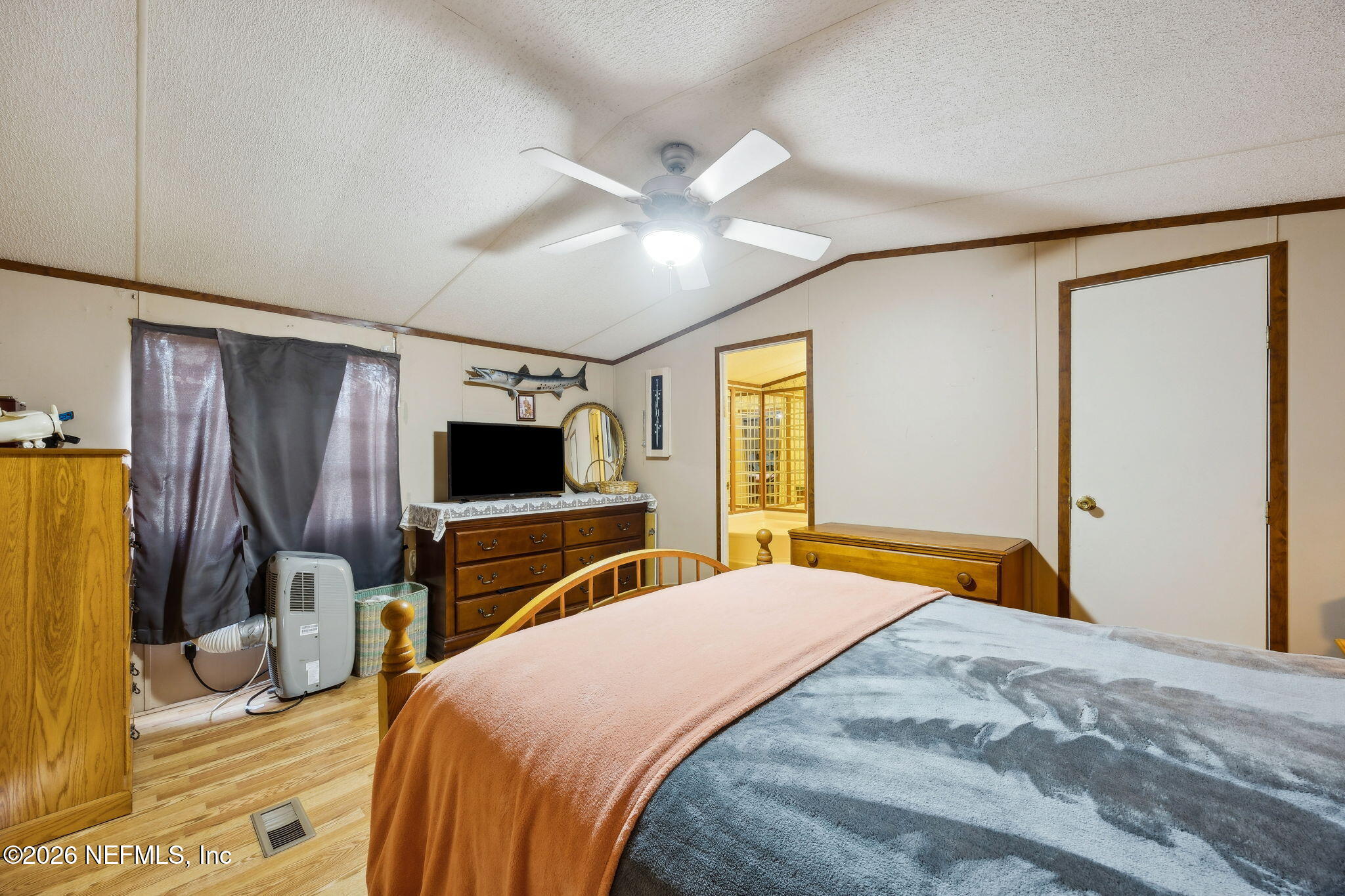54002 Trooper Court Callahan, FL 32011 - Photo 22 of 56 a bedroom with a bed and a flat screen tv