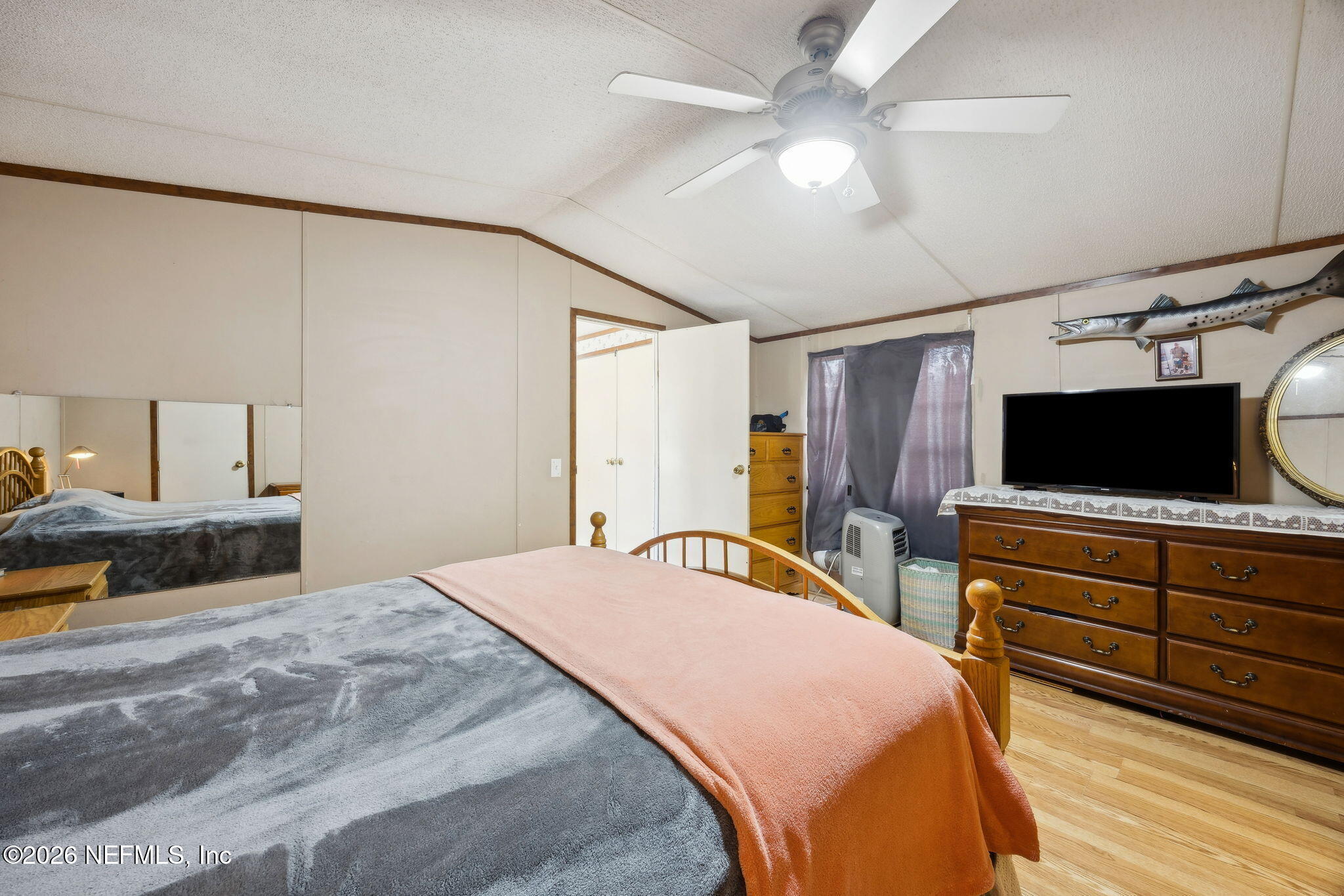 54002 Trooper Court Callahan, FL 32011 - Photo 24 of 56 a bedroom with a bed and a flat screen tv