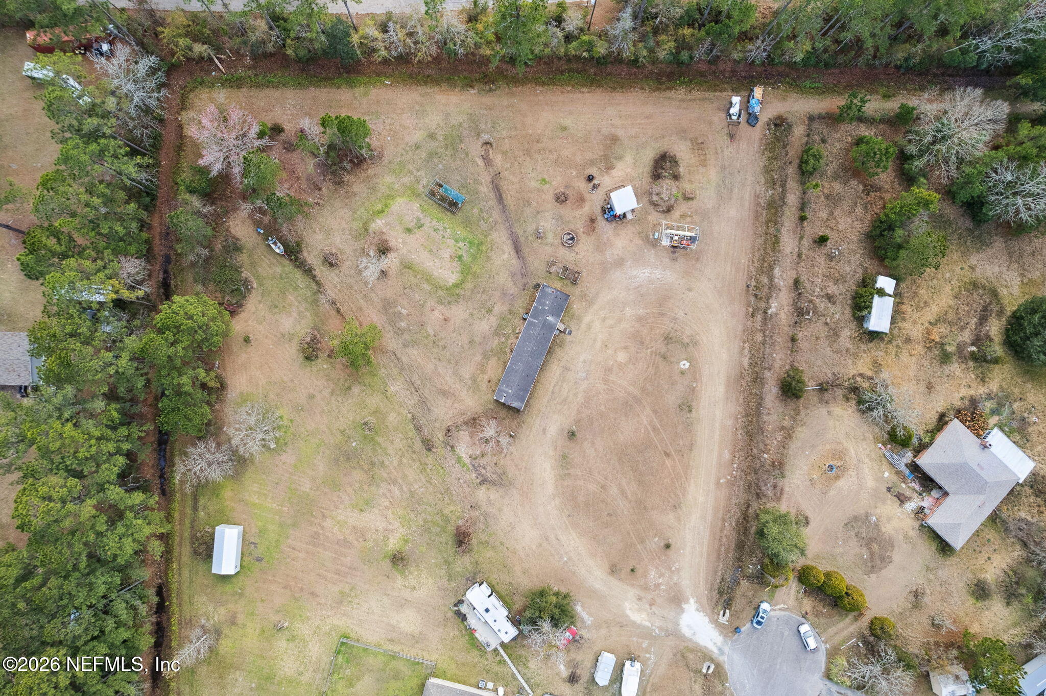 54002 Trooper Court Callahan, FL 32011 - Photo 43 of 56 an aerial view of a residential houses with outdoor space and lake view