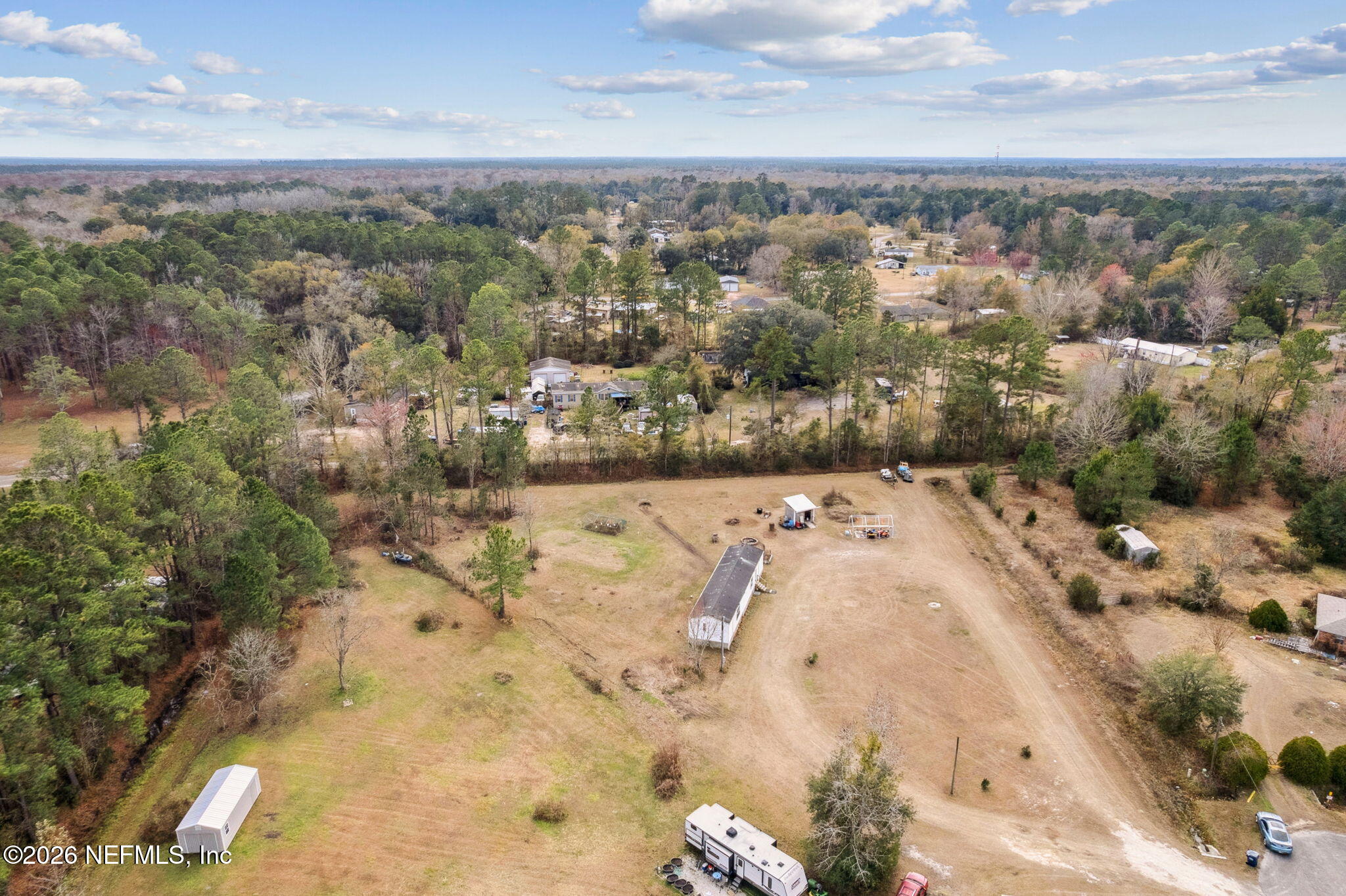 54002 Trooper Court Callahan, FL 32011 - Photo 44 of 56 an aerial view of a houses with a yard