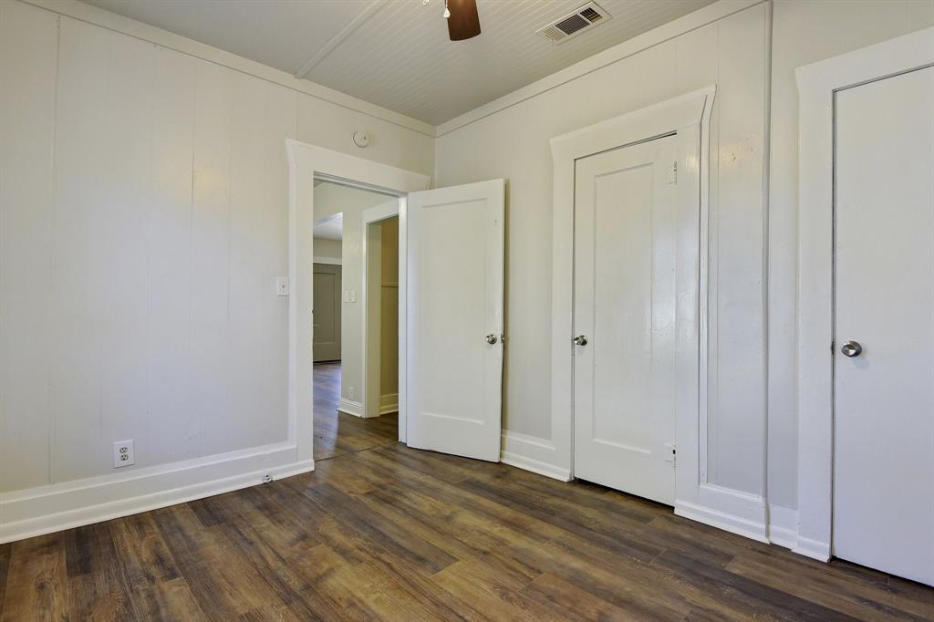 1115 South Rusk Avenue Denison, TX 75020 - Photo 12 of 21 a view of an empty room with wooden floor