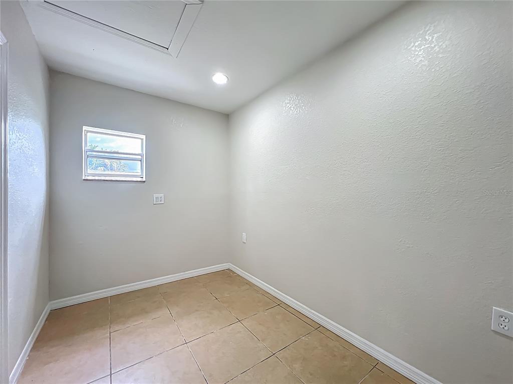 6707 Sierra Terrace New Port Richey, FL 34652 - Photo 19 of 50 an empty room with a window