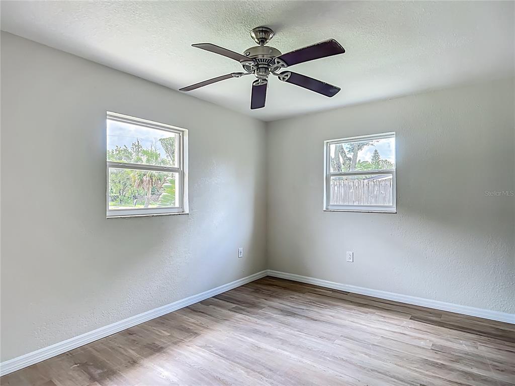 6707 Sierra Terrace New Port Richey, FL 34652 - Photo 20 of 50 a view of empty room with wooden floor