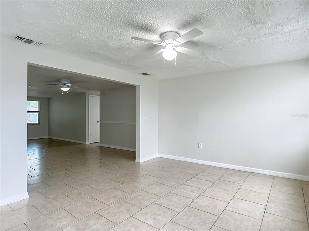 6707 Sierra Terrace New Port Richey, FL 34652 - Photo 27 of 50 a view of an empty room with a fan