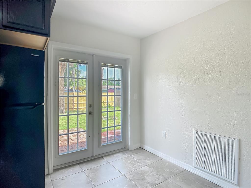 6707 Sierra Terrace New Port Richey, FL 34652 - Photo 34 of 50 a view of an empty room with glass door and balcony