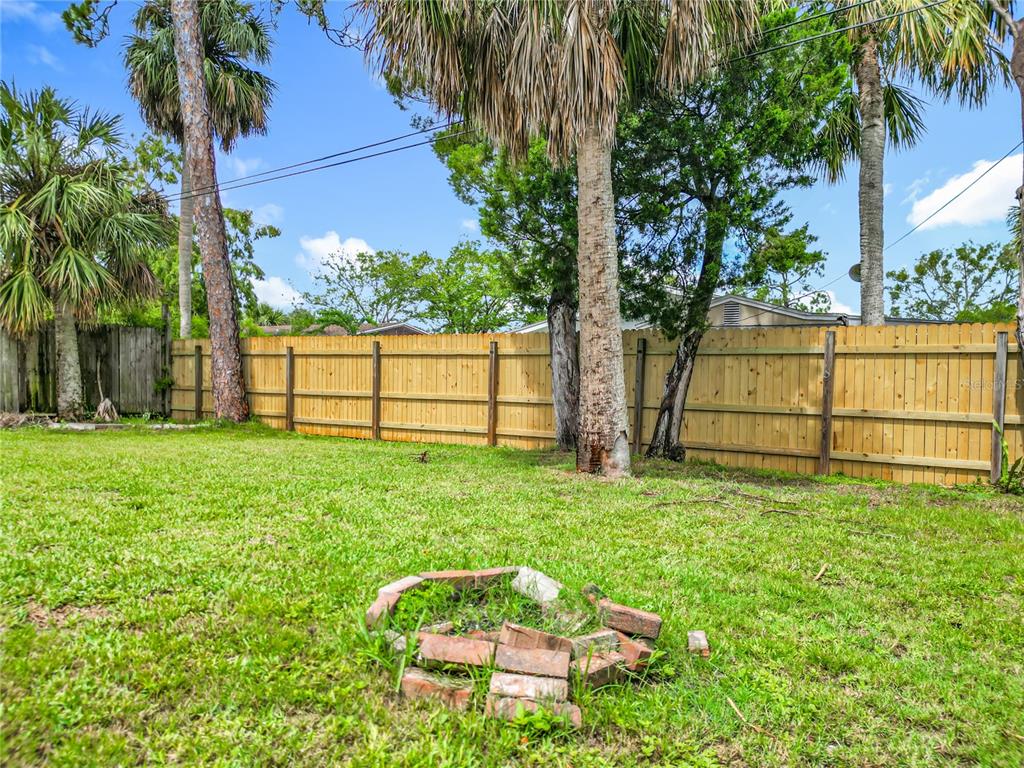 6707 Sierra Terrace New Port Richey, FL 34652 - Photo 43 of 50 a view of backyard with seating and green space