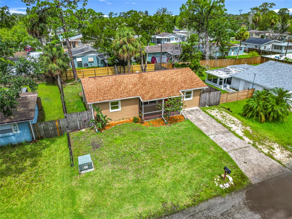 6707 Sierra Terrace New Port Richey, FL 34652 - Photo 45 of 50 an aerial view of a house with swimming pool garden and patio