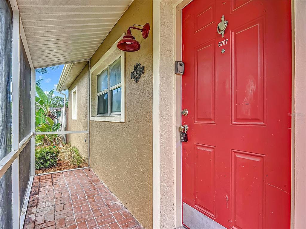 6707 Sierra Terrace New Port Richey, FL 34652 - Photo 7 of 50 a view of a entryway door with an outdoor space