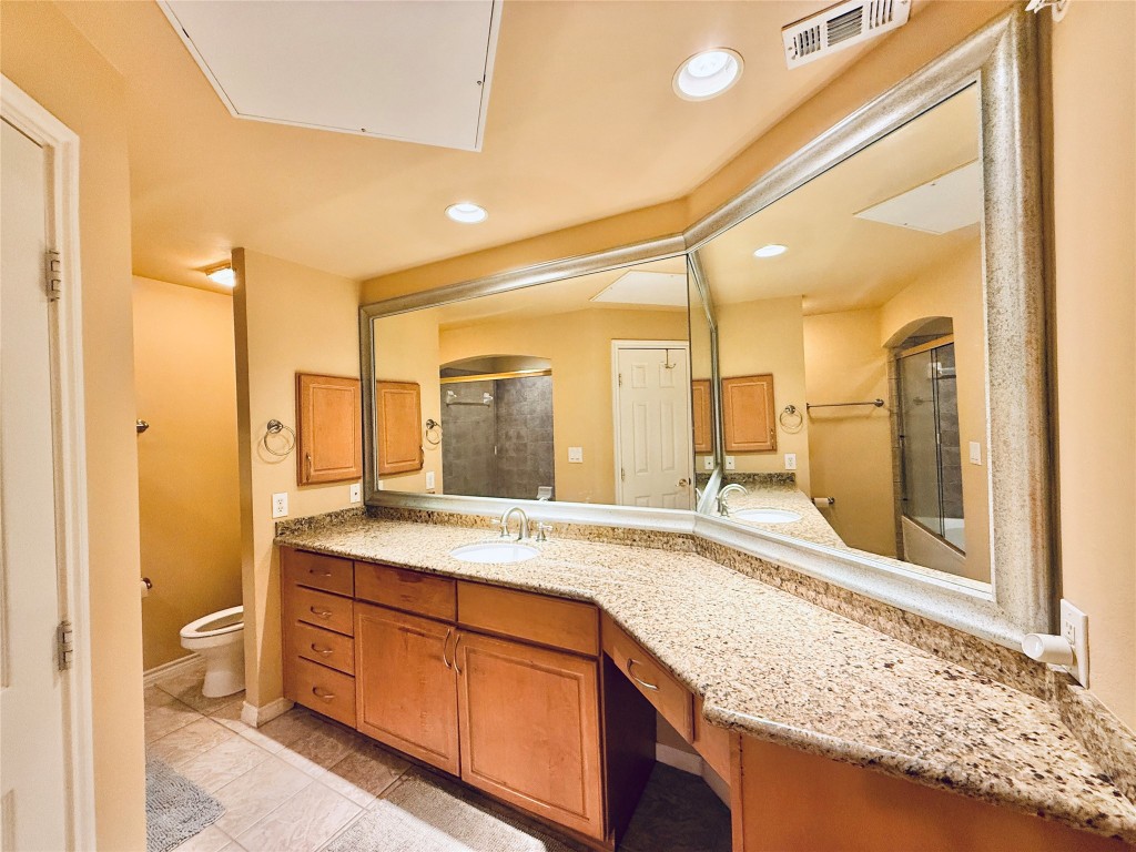 2400 McCue Road, Unit 325 Houston, TX 77056 - Photo 15 of 30 a bathroom with a granite countertop sink and a mirror