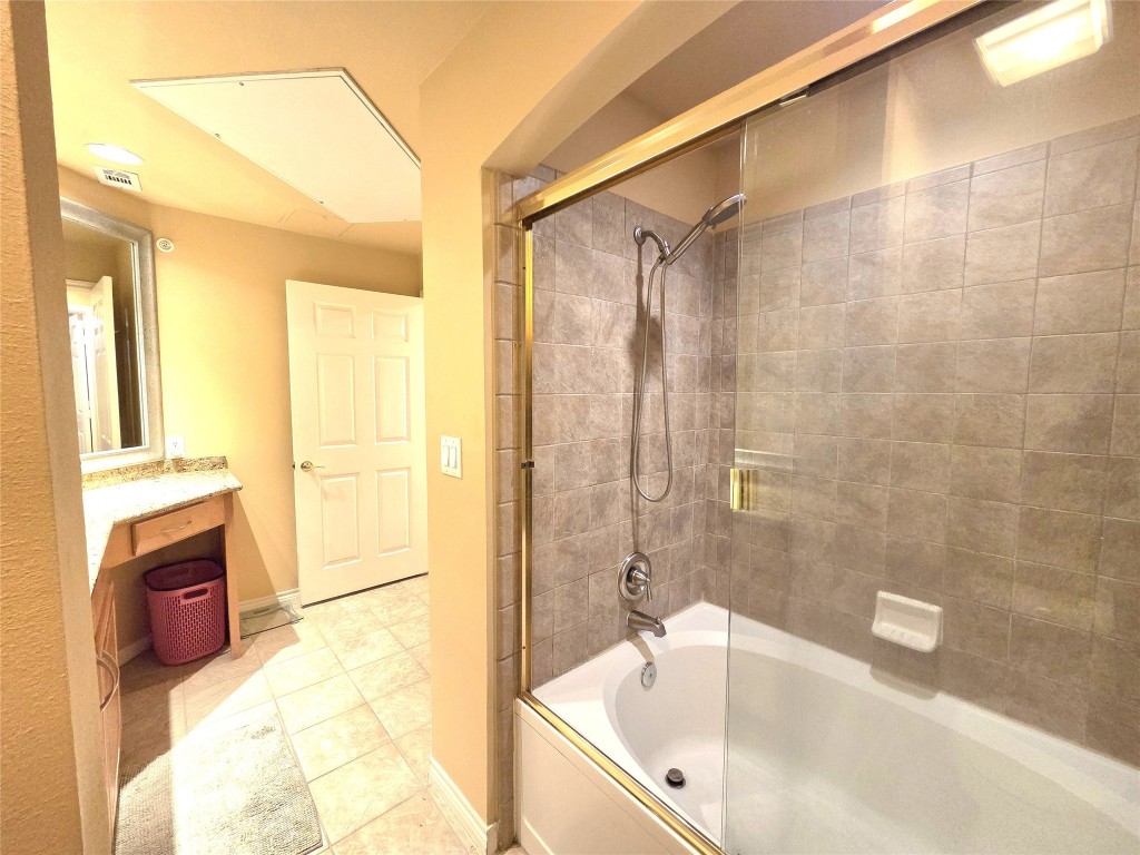 2400 McCue Road, Unit 325 Houston, TX 77056 - Photo 16 of 30 a bathroom with a tub a sink and a shower