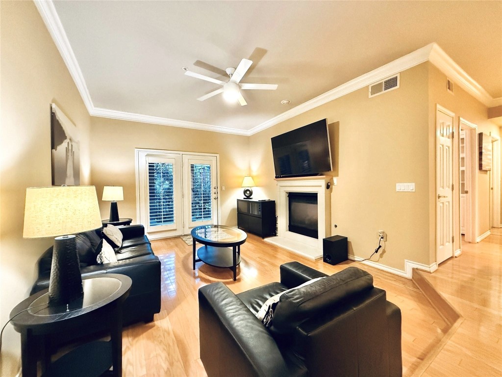 2400 McCue Road, Unit 325 Houston, TX 77056 - Photo 2 of 30 a living room with fireplace furniture and a flat screen tv