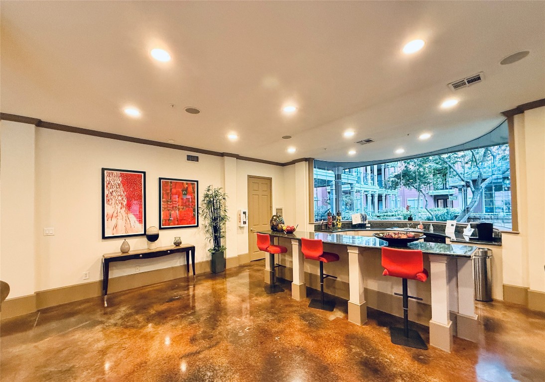 2400 McCue Road, Unit 325 Houston, TX 77056 - Photo 24 of 30 a living room with lots of furniture and kitchen view