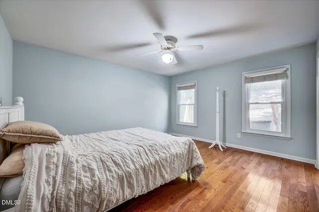 a bedroom with a large bed and a window
