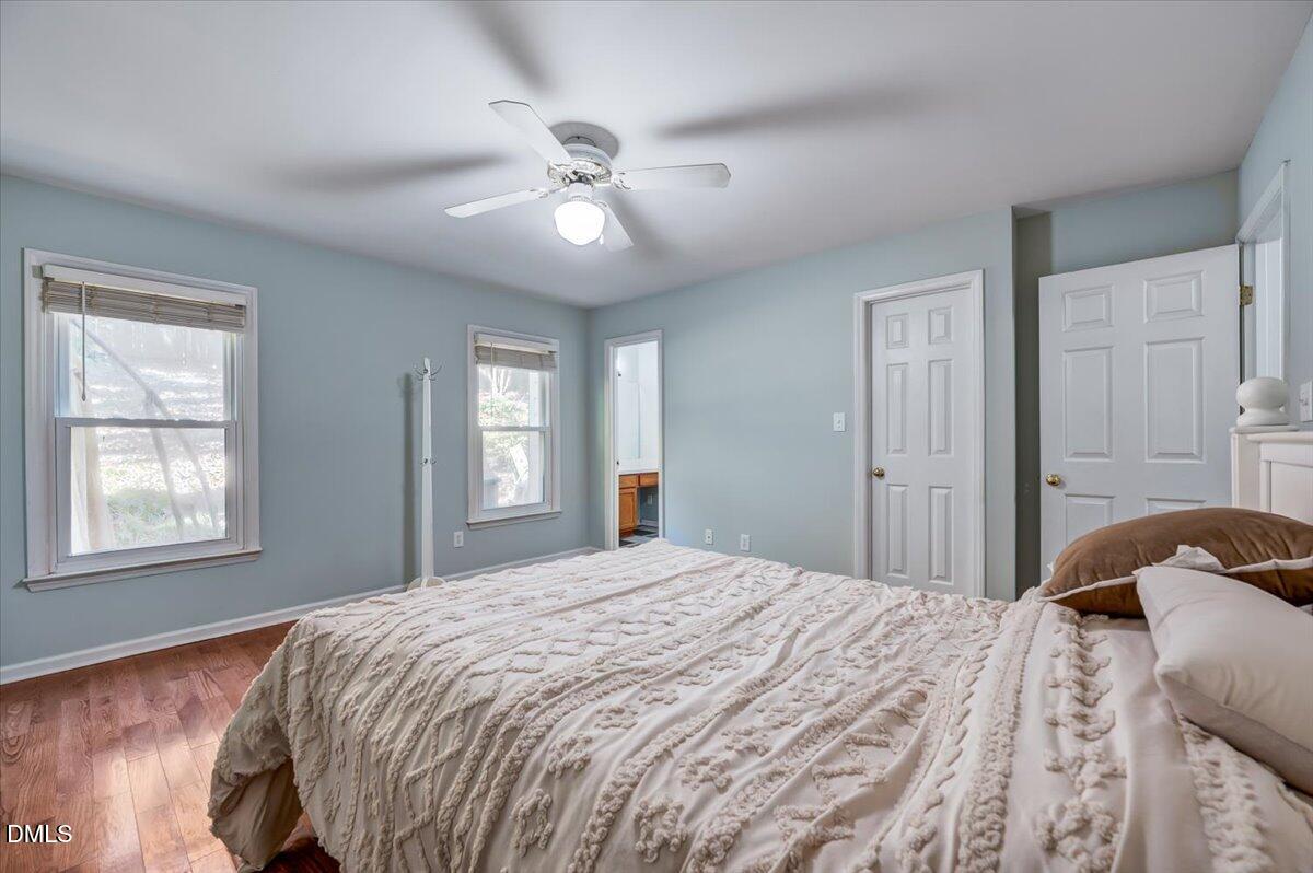 103 Kingsmill Road Cary, NC 27511 - Photo 12 of 30 a bedroom with a large bed and a window