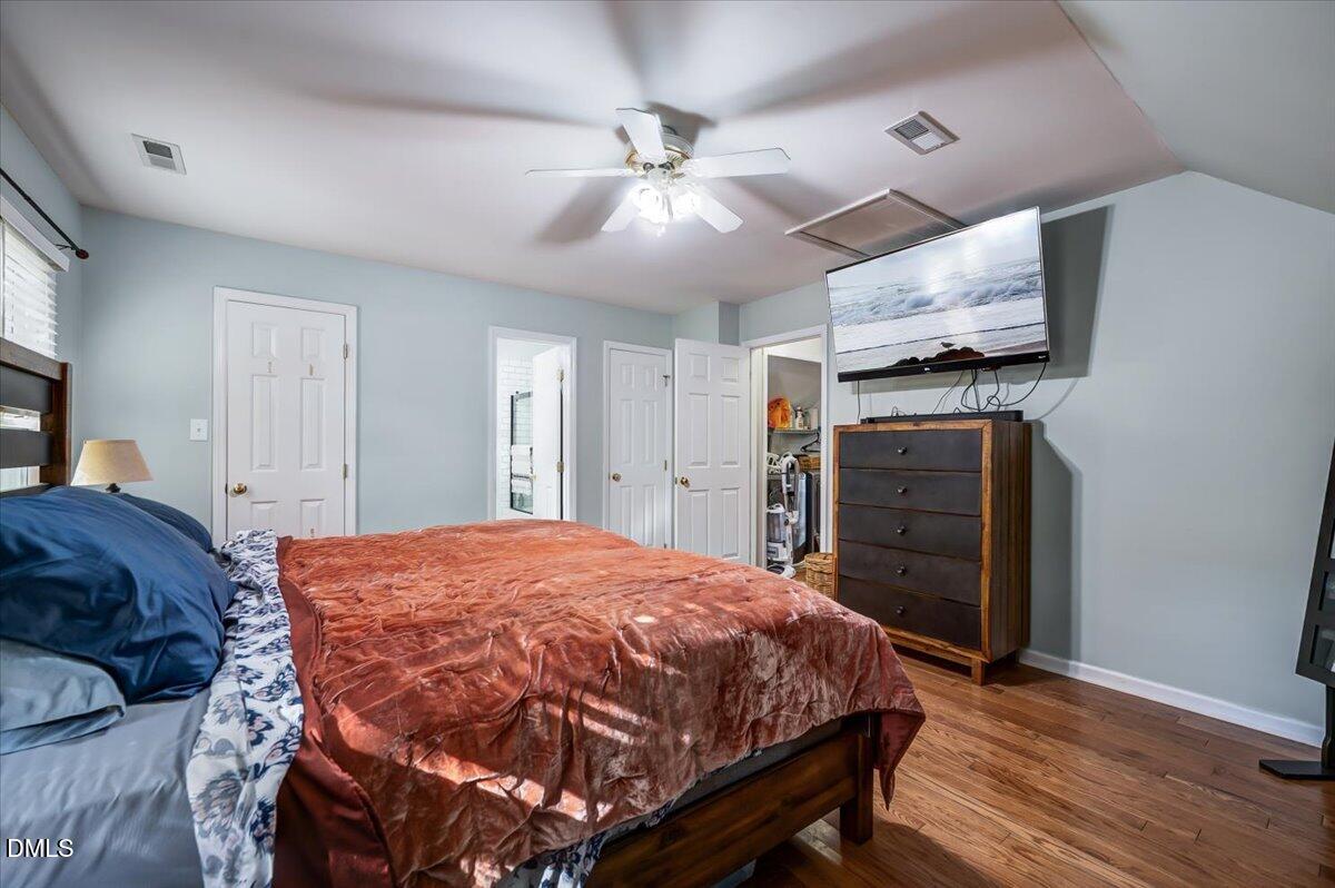 103 Kingsmill Road Cary, NC 27511 - Photo 16 of 30 a bed room with a bed and a ceiling fan