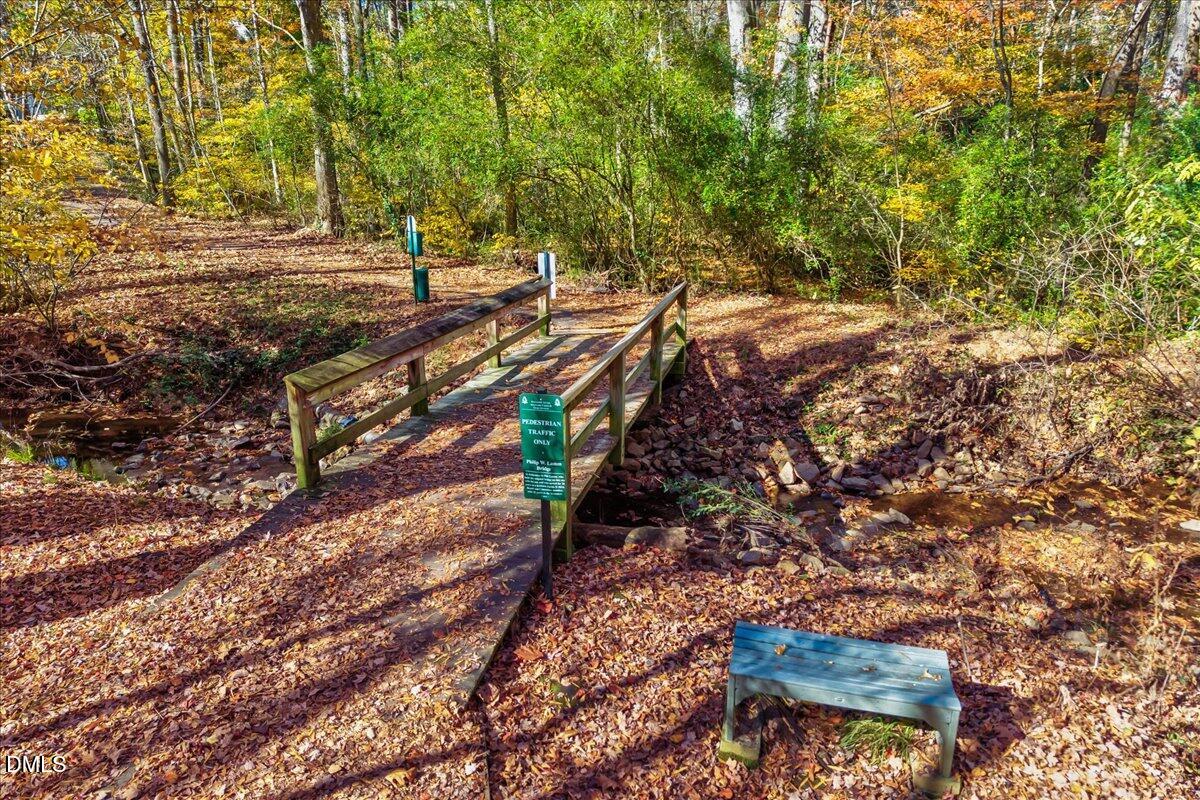 103 Kingsmill Road Cary, NC 27511 - Photo 24 of 30 a view of a yard with plants and trees