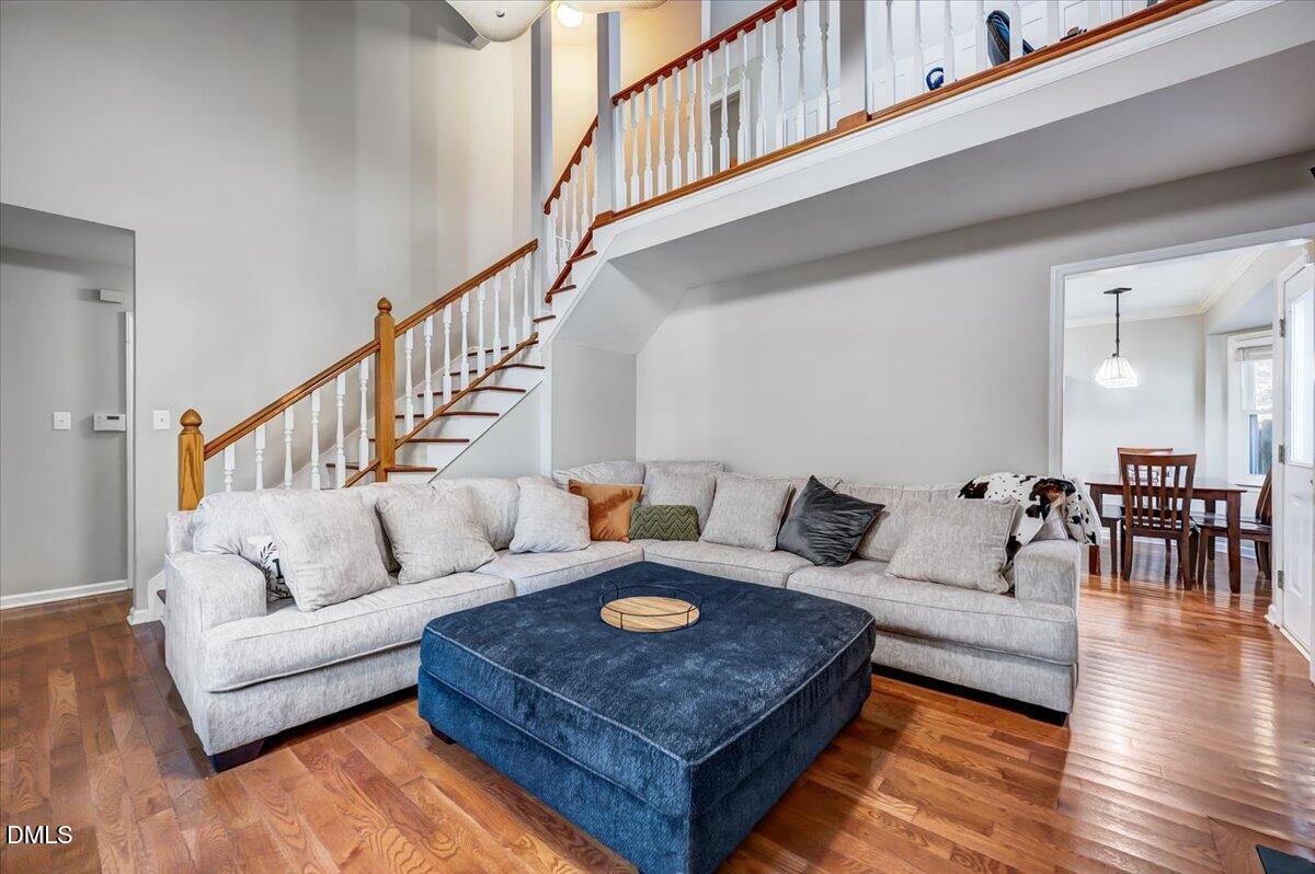 103 Kingsmill Road Cary, NC 27511 - Photo 4 of 30 a living room with furniture and wooden floor