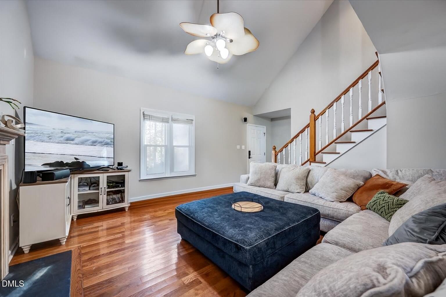 103 Kingsmill Road Cary, NC 27511 - Photo 5 of 30 a living room with furniture kitchen view and a large window