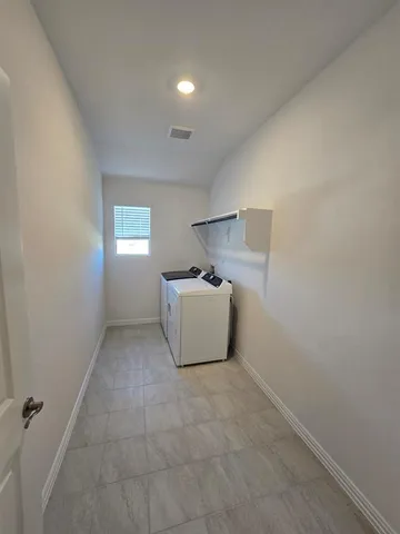 a room with a window and a lamp