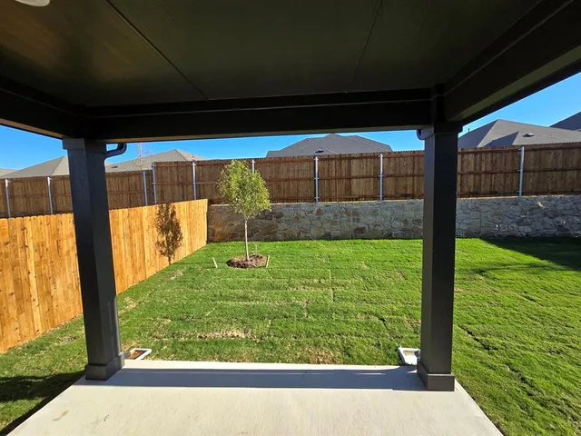 a bathroom with a double vanity sink and mirror