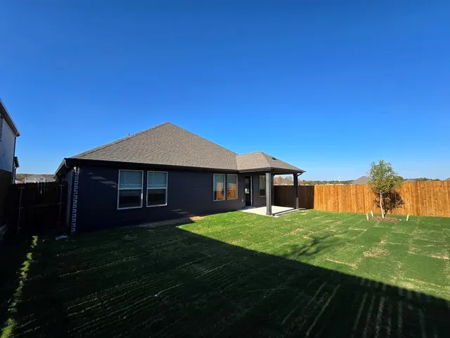 a bathroom with a shower and a sink