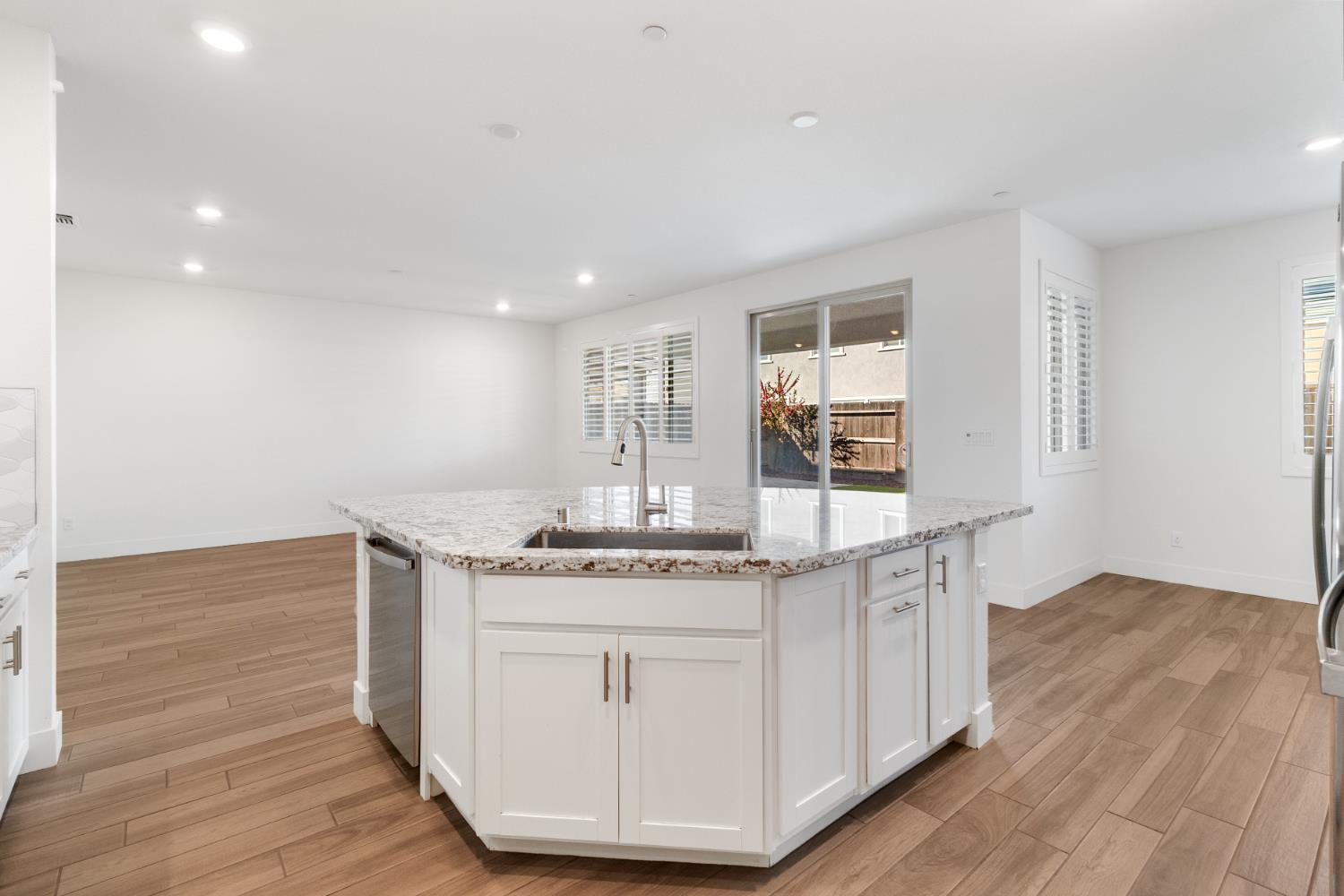 4263 Orpheus Circle Rancho Cordova, CA 95742 - Photo 14 of 51 a kitchen with stainless steel appliances granite countertop a stove and a wooden floors
