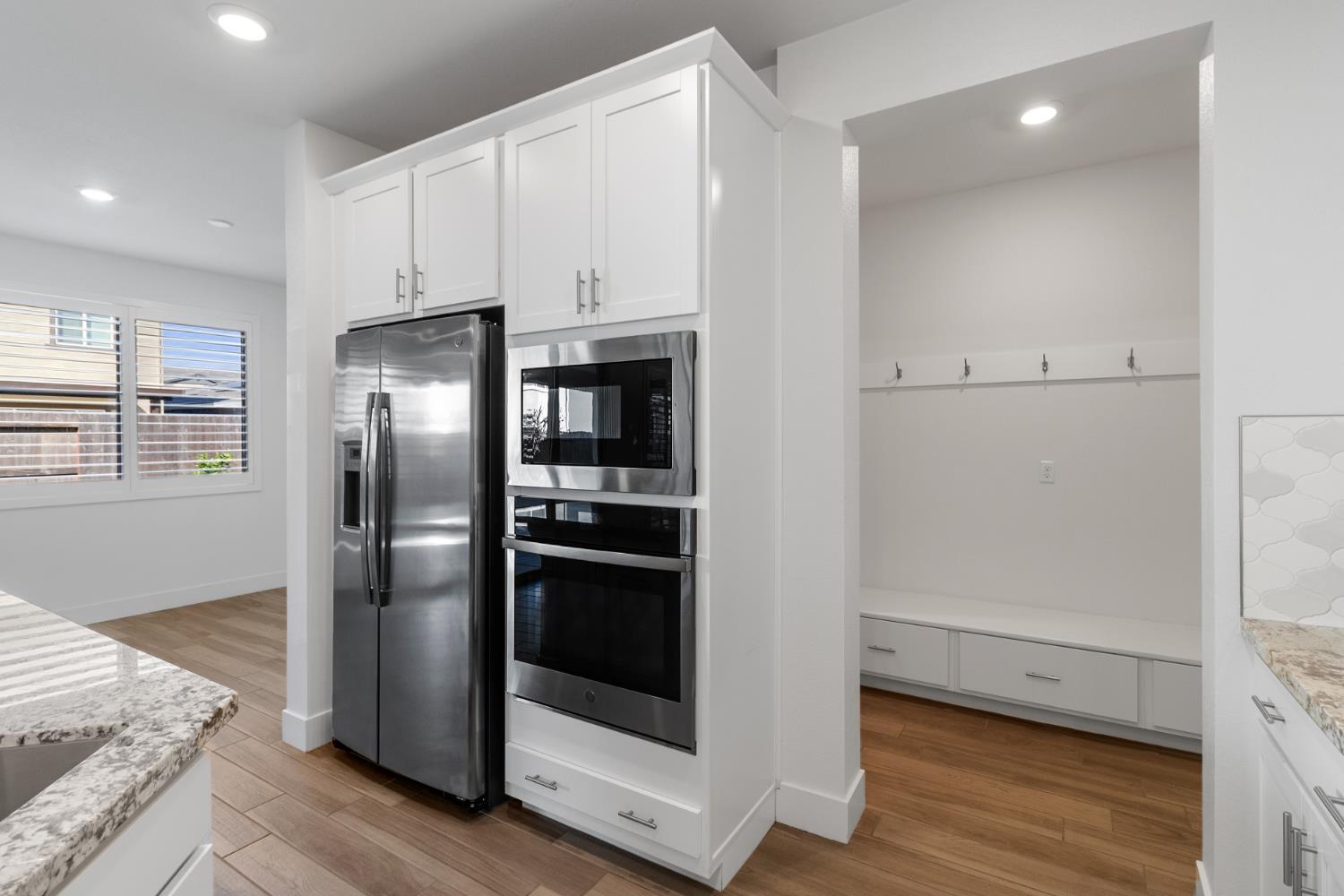 4263 Orpheus Circle Rancho Cordova, CA 95742 - Photo 15 of 51 a view of kitchen with refrigerator and wooden floor