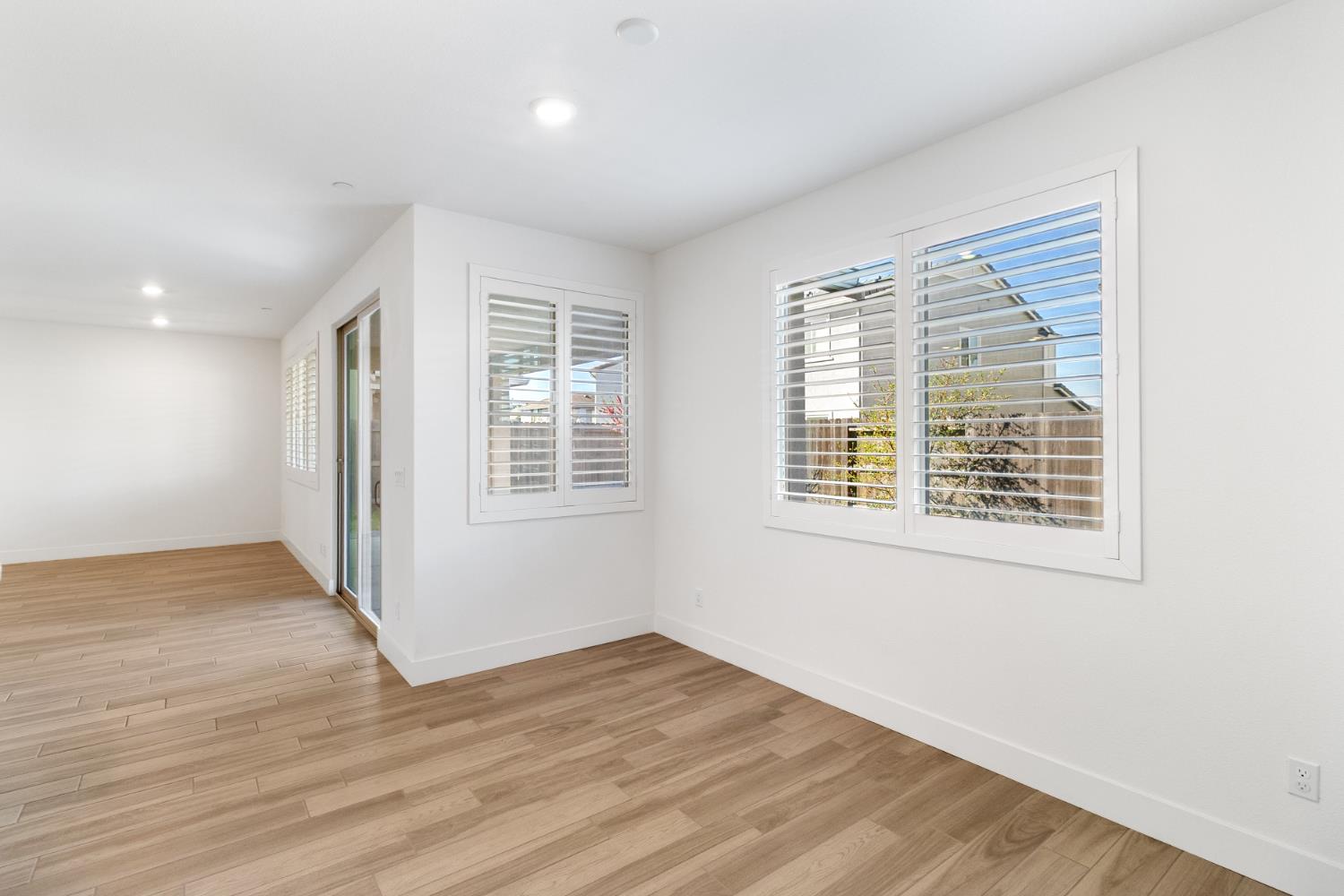 4263 Orpheus Circle Rancho Cordova, CA 95742 - Photo 18 of 51 a view of an empty room with wooden floor and a window